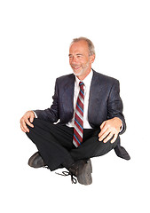 Image showing Middle age mal sitting on floor.