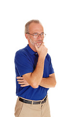 Image showing Thinking middle age male with hand on chin.