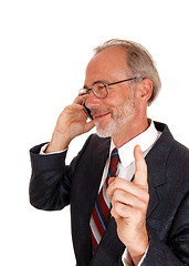Image showing Happy businessman on cell phone.