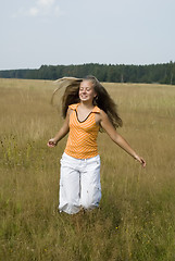 Image showing Girl plays on a meadow II