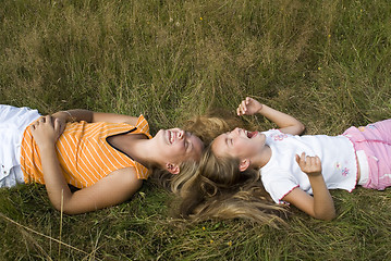 Image showing Girls plays on a meadow III