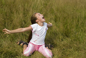 Image showing Girl plays on a meadow IV