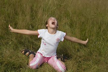 Image showing Girl plays on a meadow V