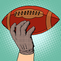 Image showing The ball of American football in his hand