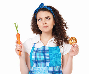Image showing Girl with carrot and cookie