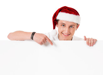 Image showing Young man in Santa hat