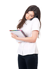 Image showing Woman with notepad and phone