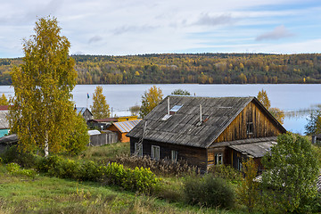 Image showing Old peasant house on the shore of forest lake