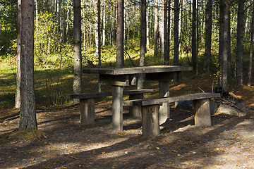 Image showing Wooden table and benches in the forest