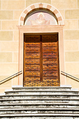 Image showing sunny daY italy church tradate    the old door entrance  mosaic