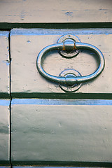 Image showing  tradate abstract   rusty  brown knocker   curch  closed  lombar