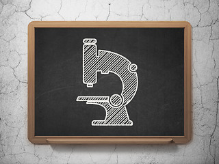 Image showing Science concept: Microscope on chalkboard background