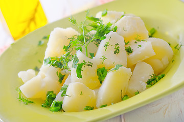Image showing boiled potato with greens in the green plate