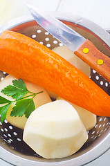 Image showing Raw potato and carrot in the metal bowl