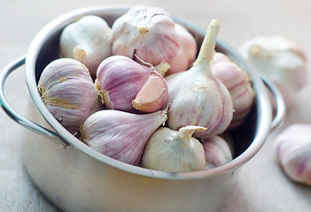 Image showing garlic in metal bowl on the table