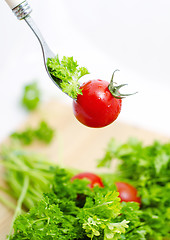 Image showing Fresh tomato cherri and green salad