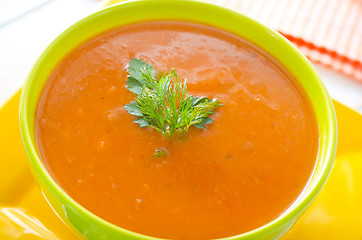 Image showing Fresh soup from pumpkin in the green bowl