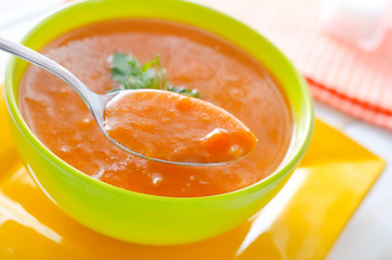 Image showing Fresh soup from pumpkin in the green bowl