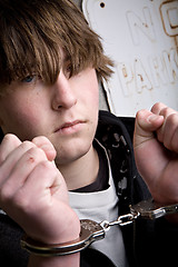 Image showing teen in handcuffs - crime