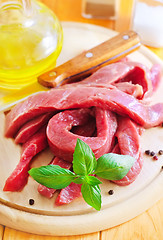 Image showing raw meat on the wooden board