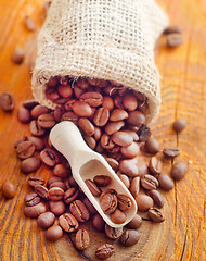 Image showing Aroma coffee in the sack on the wooden board