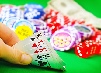 Image showing Card for poker in the hand, chips and card for poker