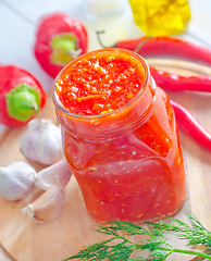 Image showing Fresh chilli sauce in the glass bank
