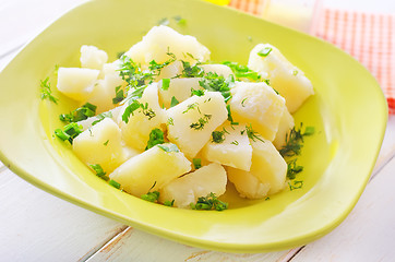 Image showing boiled potato with greens in the green plate