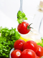 Image showing Fresh tomato cherri and green salad