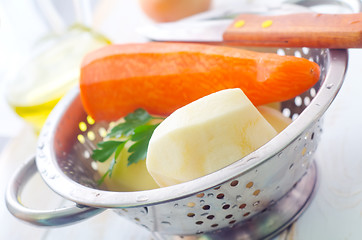 Image showing Raw potato and carrot in the metal bowl