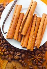 Image showing cinnamon and coffee on the white plate