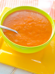 Image showing Fresh soup from pumpkin in the green bowl