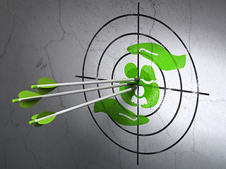 Image showing Insurance concept: arrows in Family And Palm target on wall background