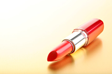 Image showing lipstick closeup golden background