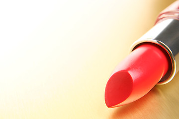 Image showing lipstick on gold background