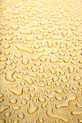 Image showing water droplets gold background