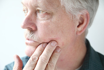 Image showing itchy rash on man's face