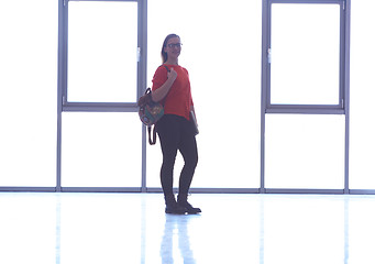 Image showing student girl standing with laptop, people group passing by