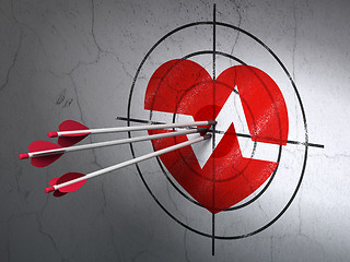 Image showing Healthcare concept: arrows in Heart target on wall background