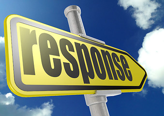 Image showing Yellow road sign with response word under blue sky