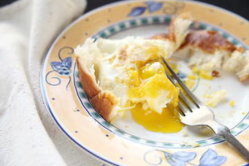 Image showing Eggs over easy with bread