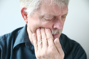 Image showing Man suffers from face pain