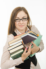 Image showing Portrait of a teacher with books and notebooks
