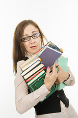 Image showing Funny teacher with books and notebooks