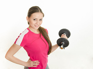 Image showing Self-confident athlete with dumbbells in hand