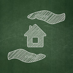 Image showing Insurance concept: House And Palm on chalkboard background