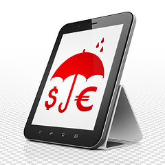 Image showing Security concept: Tablet Computer with Money And Umbrella on display