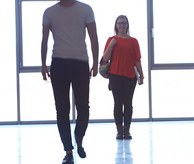 Image showing student girl standing with laptop, people group passing by