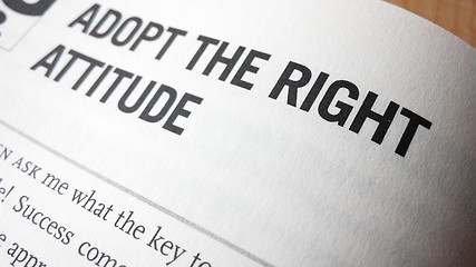 Image showing Adopt the right attitude word on a book