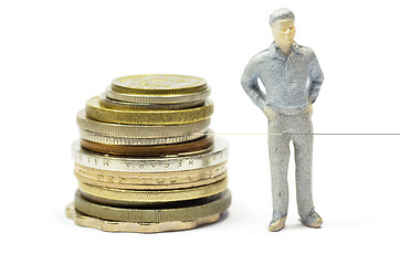 Image showing Miniature people with coins